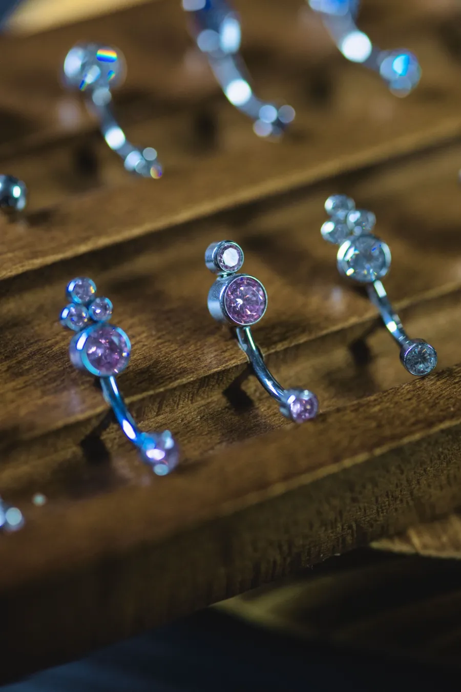 Pink crystal cluster belly rings